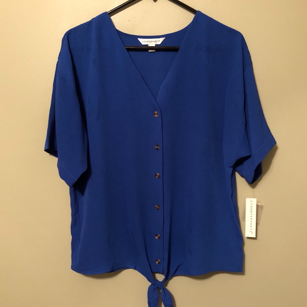 Classy & comfy! Pair with black leggings and boots! Long enough in front/back